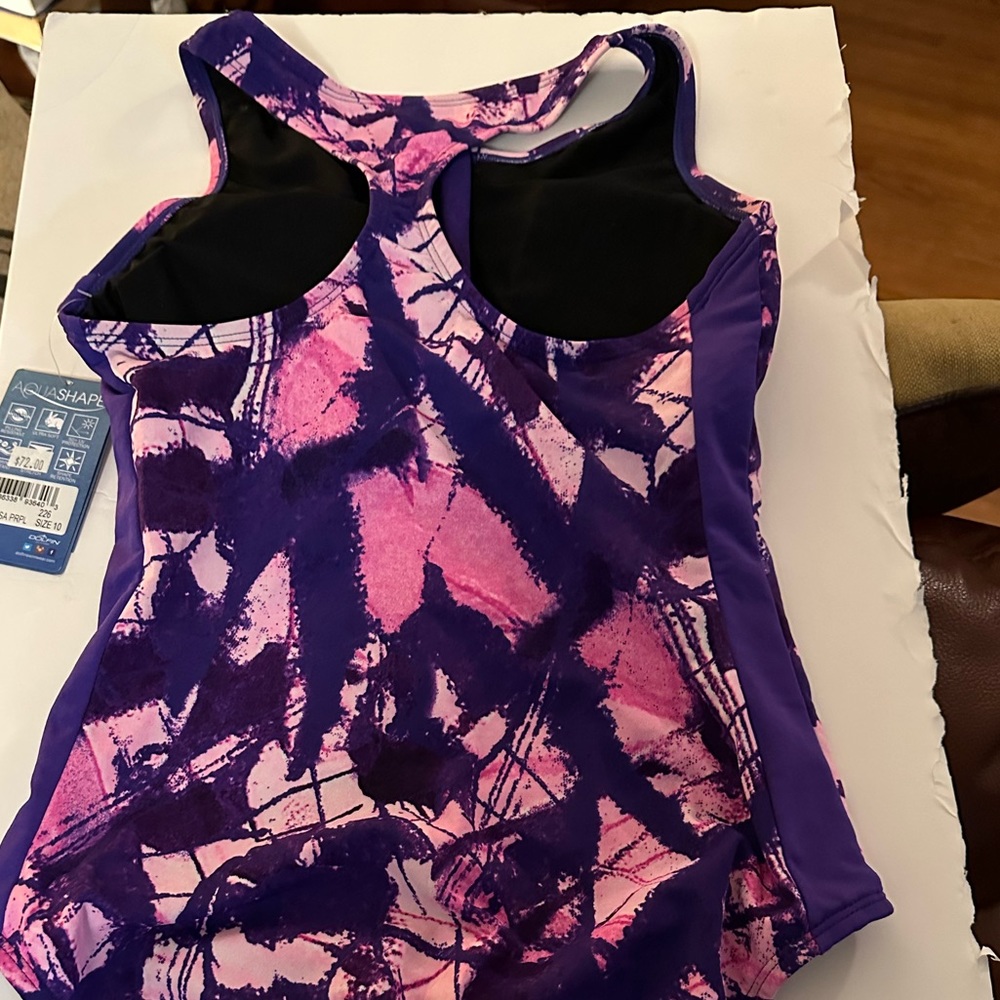 Dolphin NWT size 10 chlorine resistant bathing suit. Note I am 5’8. Runs short.
